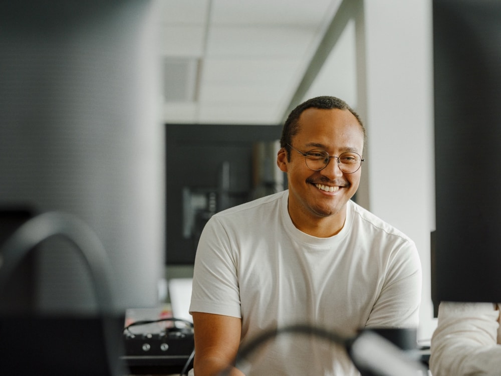A colleague smiling during a break in the day